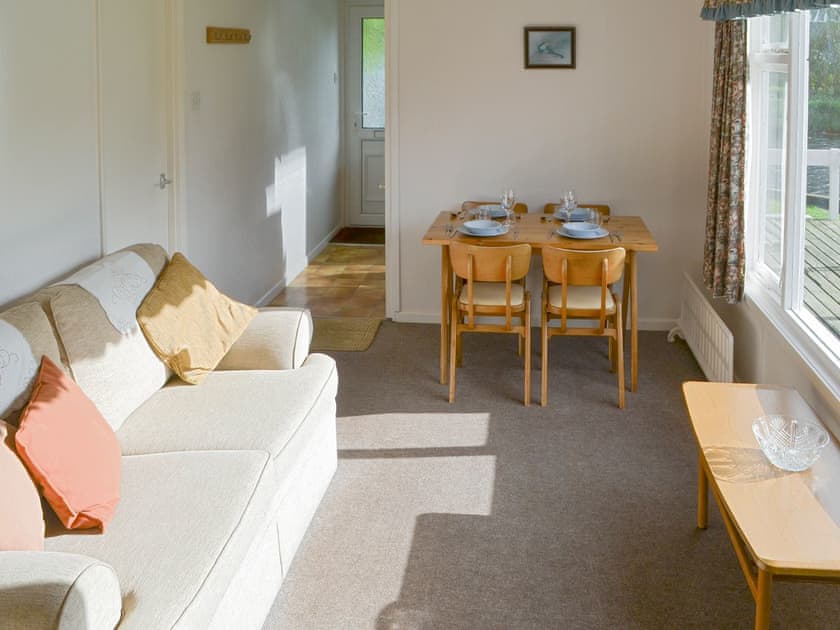 Light and airy living room with dining area | Silver Birches, Horning
