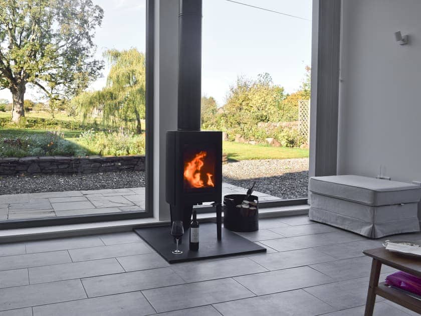 Contemporary living space with wood burner and views of the garden | Rowanlea, Muthill, near Crieff