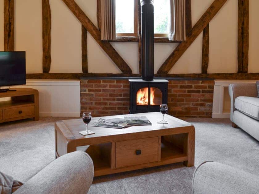 Cosy living room with wood burning stove | Hale Barn, Chiddingly, near Lewes