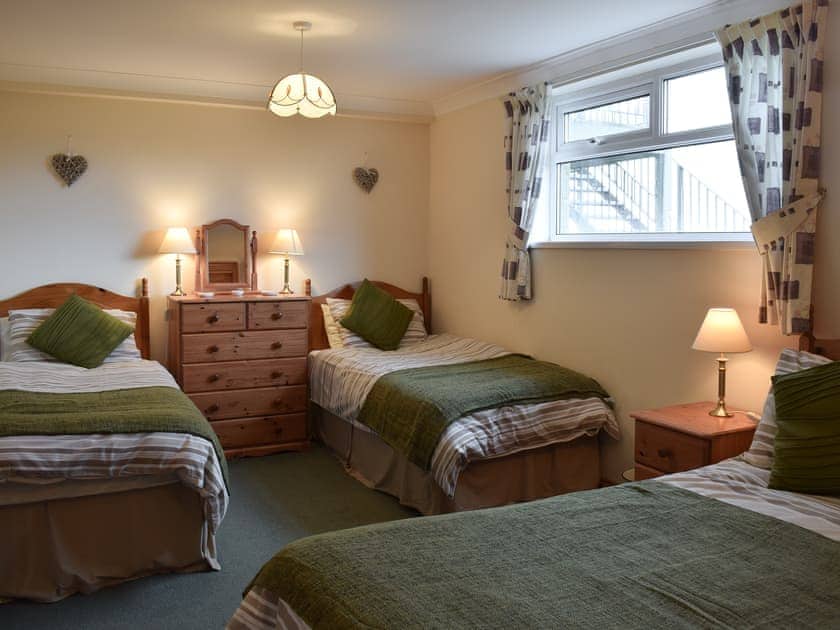 Bedroom with double and 2 single beds | Pen Y Bryn Apartment, Manordeilo, near Llandeilo