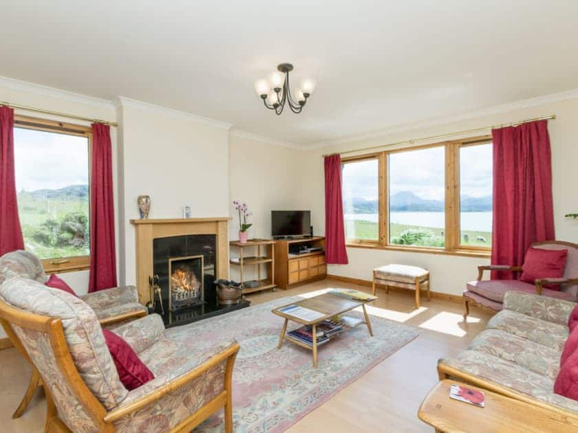 Spacious living room, windows overlooking Gairloch Bay to the magnificent Torridon Mountains | Ach-na-Clachan, Gairloch