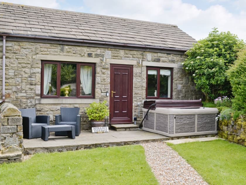Exterior featuring private hot tub | Hollies Cottage - Buckley Green Bottom Farm, Buckley Green, near Haworth