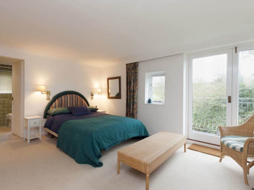 Double bedroom with ensuite bathroom and french doors to balcony  | Spring Shaw, Salcombe