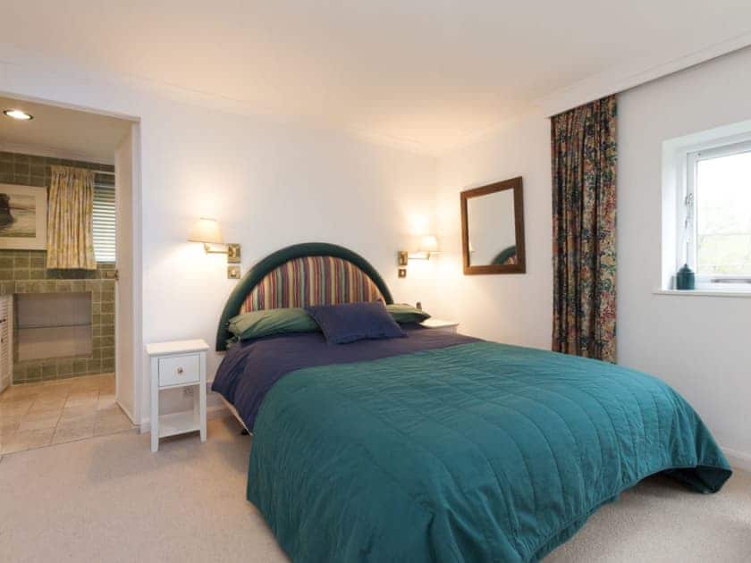 Double bedroom with ensuite bathroom and french doors to balcony  | Spring Shaw, Salcombe
