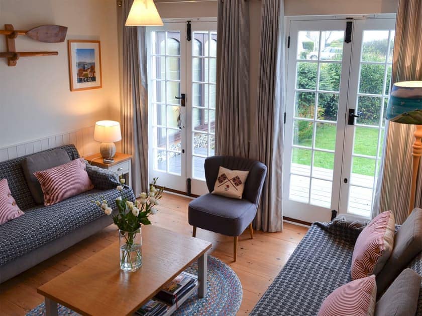 French doors from the living room lead onto a delightful terrace | Violet Cottage, Kingsdown, near Deal