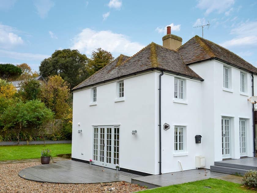 Large enclosed lawned garden with sitting-out area | Violet Cottage, Kingsdown, near Deal