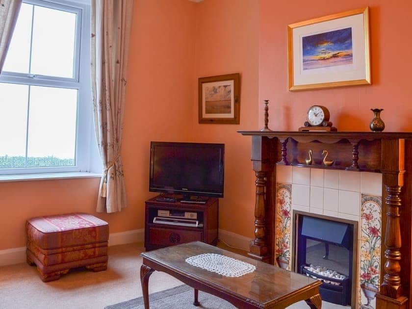 Light and airy living room with feature fireplace | Shingle Cottage, Seascale, near Eskdale