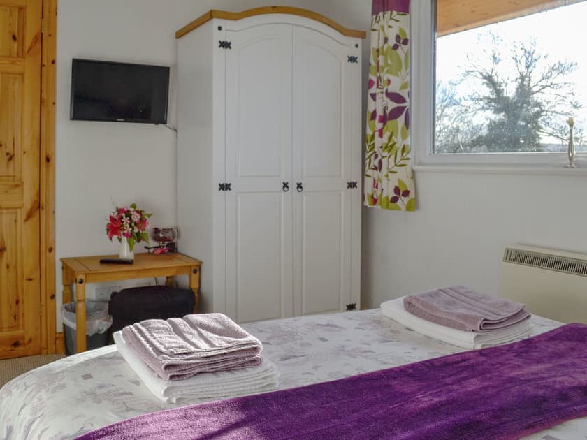 The double bedroom is well decorated and furnished to a high standard | Bryn Rodyn, Graigfechan, near Ruthin