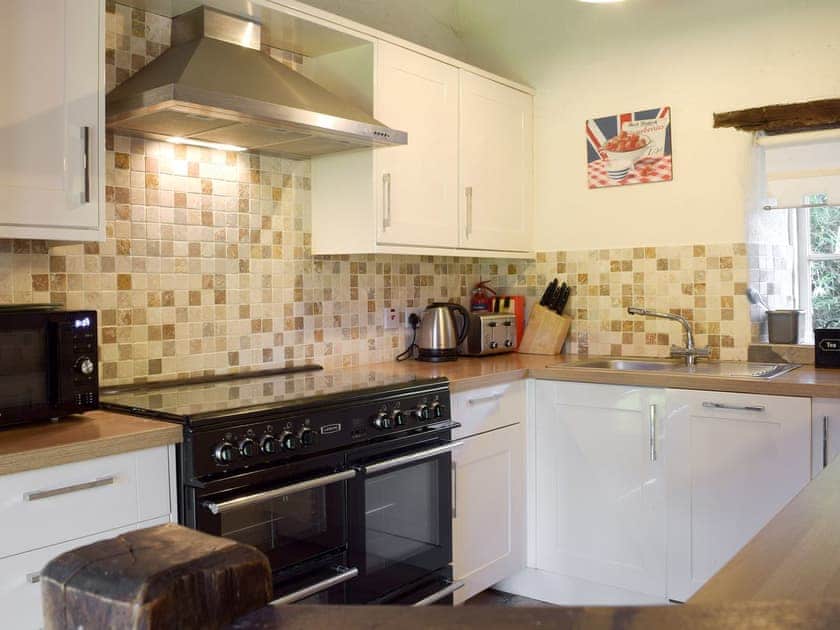 Well equipped kitchen area | Granary Cottage - Ivy Court Cottages, Llys-y-Fran