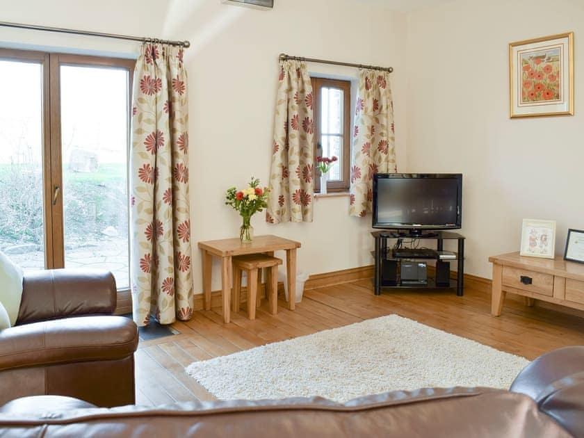 Welcoming living area | Beudy Bach - Ffynnonmeredydd Cottages, Mydroilyn, near Aberaeron