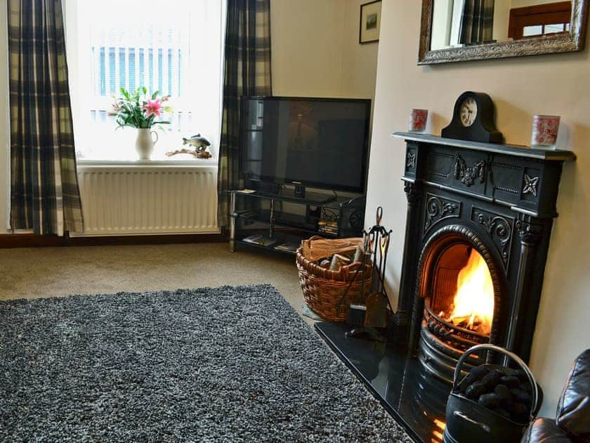 Warm and welcoming living room with open fire | Rose Cottage, Norham, near Berwick-upon-Tweed