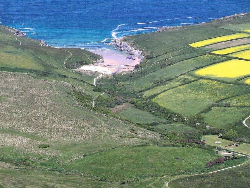 Aerial shot of Porth Joke beach adjacent to Cubert Common a 15 min walk from the property | The Old Stable - Lewannick Farm, Holywell Bay, near Perranporth