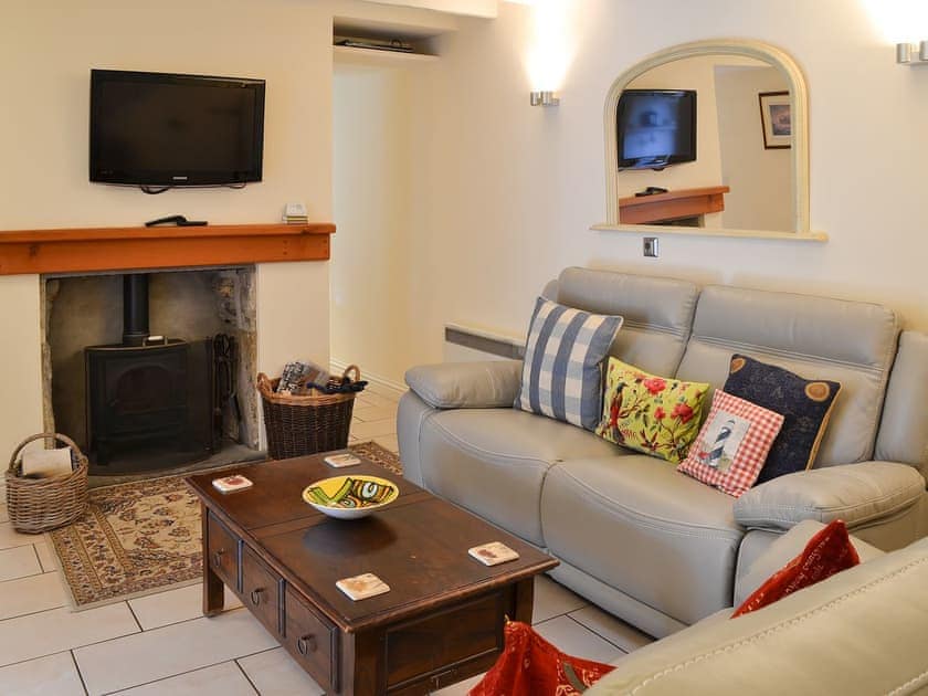 Cosy well presented living room with wood burner | Railston Cottage, Seahouses