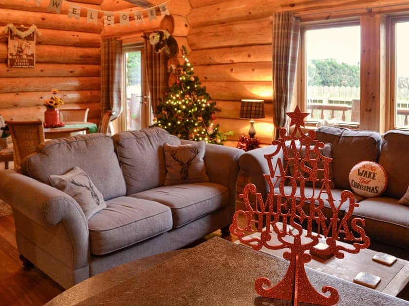 Living area decorated for Christmas | Fir Tree Lodge - Bryn y Pin Lodges, Groesffordd Marli, near Abergele
