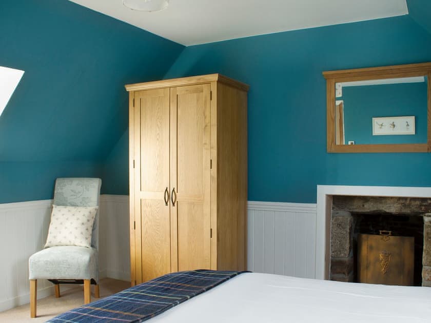 Attractively decorated double bedroom with kingsize bed | Ethel’s House, Armadale, near Bettyhill