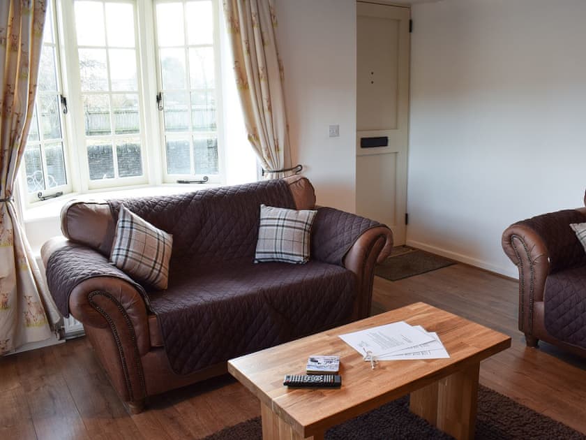 Living room with wood burner | Yew Tree Cottage, West Ayton, near Scarborough