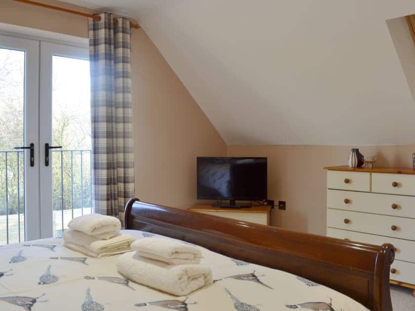 Comfortable double bedroom with Juliet balcony | Quarry Lodge, Munsley, near Ledbury