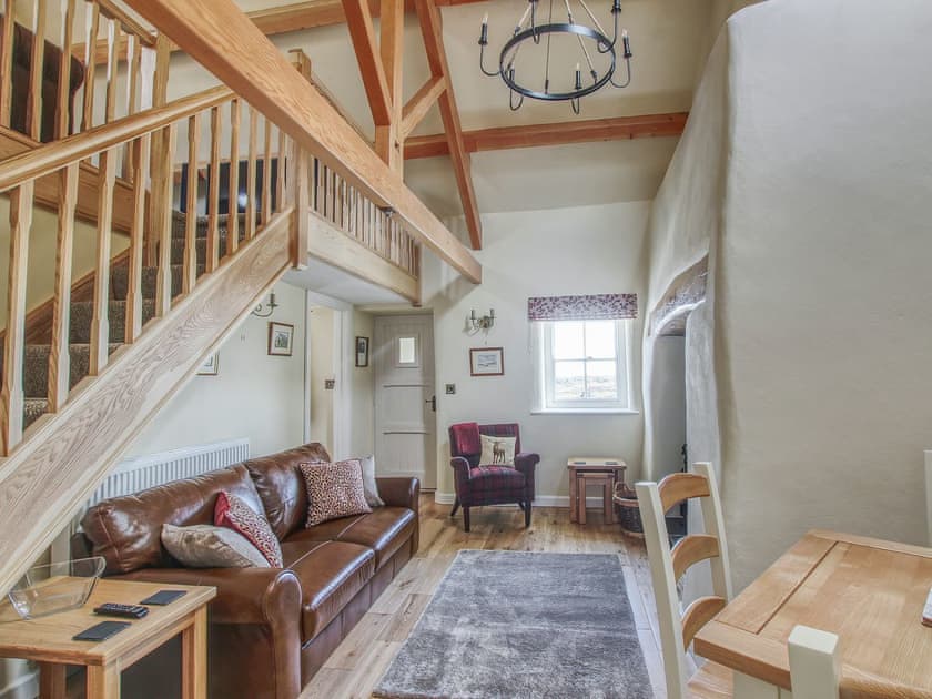 Comfy seating in living room | Fferam Gorniog, Holyhead Mountain, near Trearddur Bay