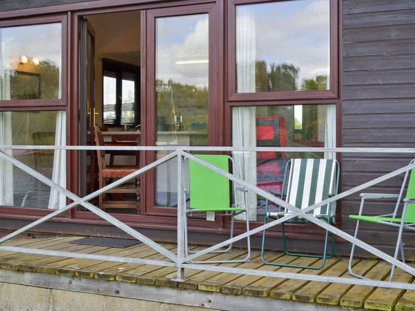 Decked area at front of holiday home | Yare View Lodge, Brundall 