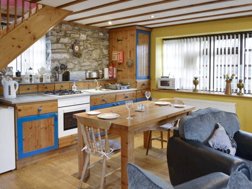 Well-equipped fitted kitchen | The Coach House at Old Vicarage Cottage, Betws-yn-Rhos, near Abergele