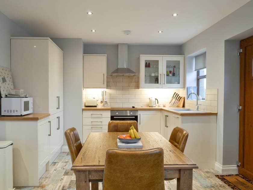 Well-equipped fitted kitchen with dining area | The Corn Store - Millmoor Farm, Bickley, near Malpas