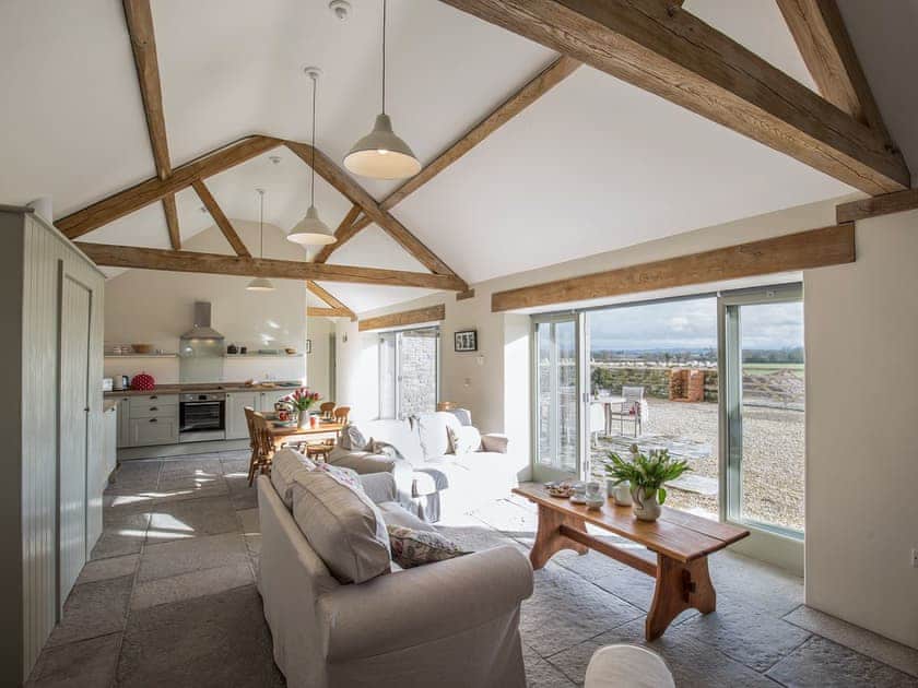 Open plan living space with wood beams | Long Barn - Bramleys Yard, Baltonsborough, near Glastonbury
