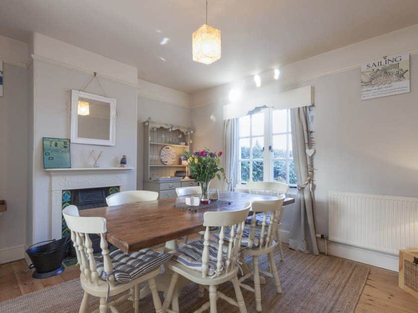 Dining room with lovely views of the garden and the countryside beyond | Torrings, Salcombe