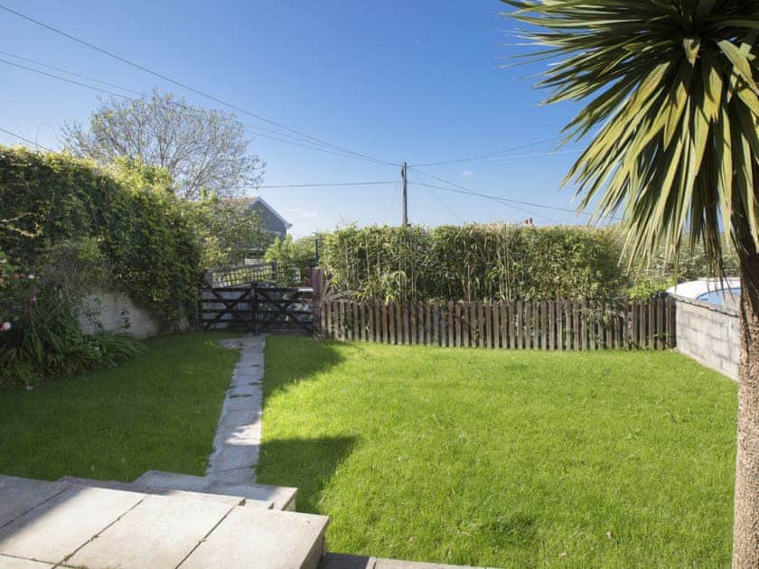 Lawned garden with patio and BBQ area | Torrings, Salcombe