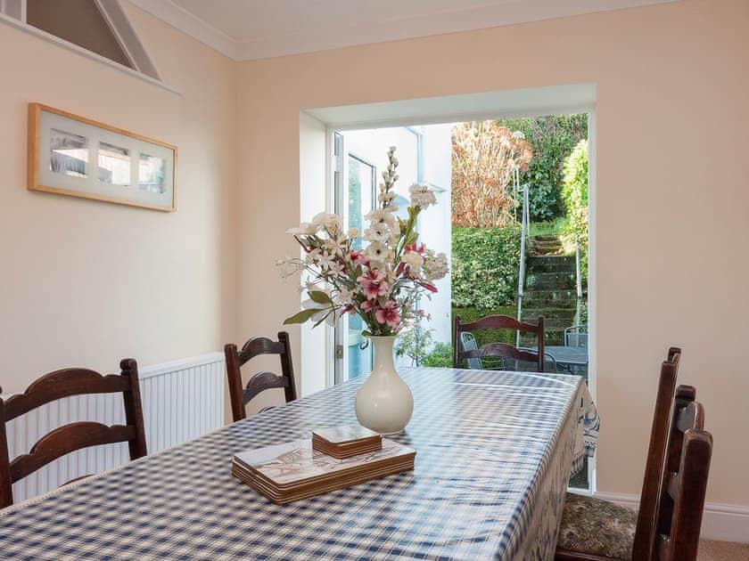 Delightful dining room with French doors to the patio and garden | Sandquay Road 9, Dartmouth