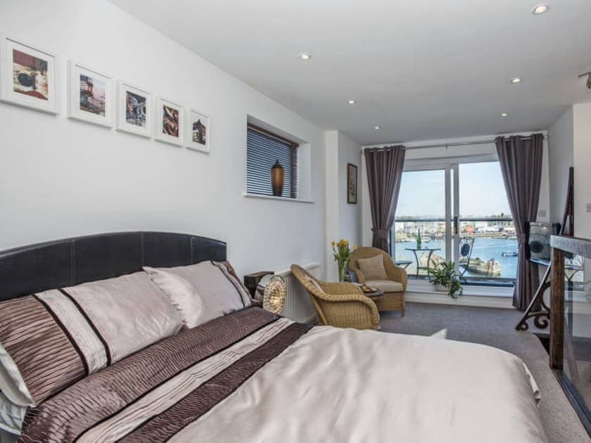 Exquisitely presented master bedroom with private balcony | The Shipwreck - The Shipwreck and The Barnacle, Oulton Broad, near Lowestoft