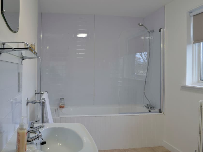 Family bathroom with shower over bath | The Coach House, Alford