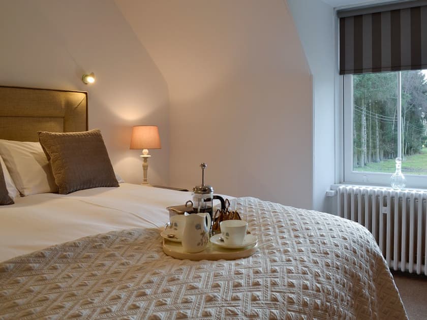 Enjoy breakfast in bed in the sumptuous double bedroom | The Coach House, Alford