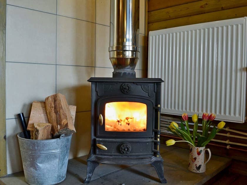 Warm and toasty wood burner | Kestrel Cabin - Wallace Lane Farm Cottages, Brocklebank, near Caldbeck and Uldale