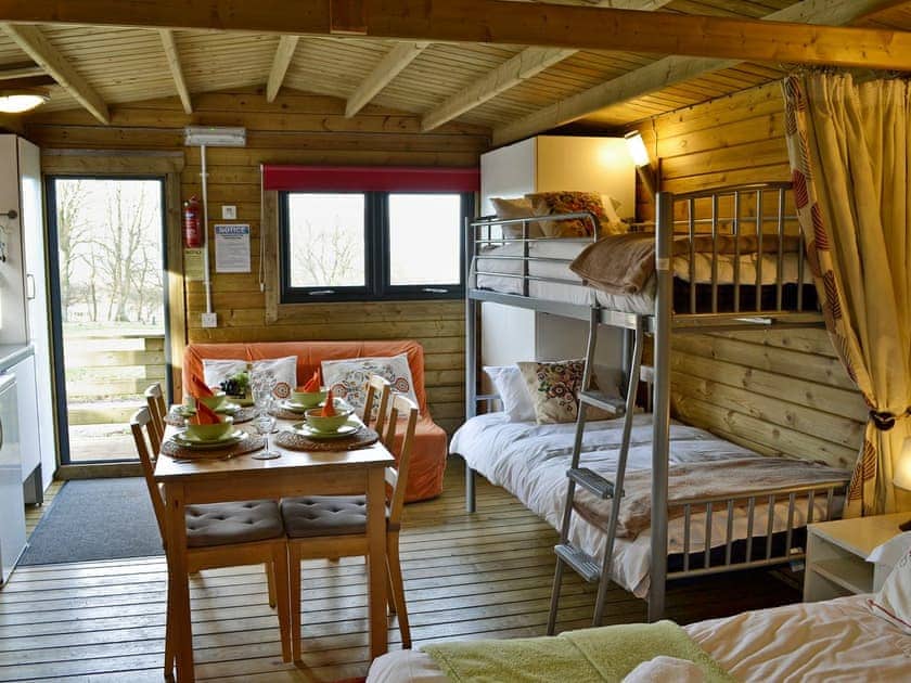 Well furnished open plan living and sleeping space | Kestrel Cabin - Wallace Lane Farm Cottages, Brocklebank, near Caldbeck and Uldale