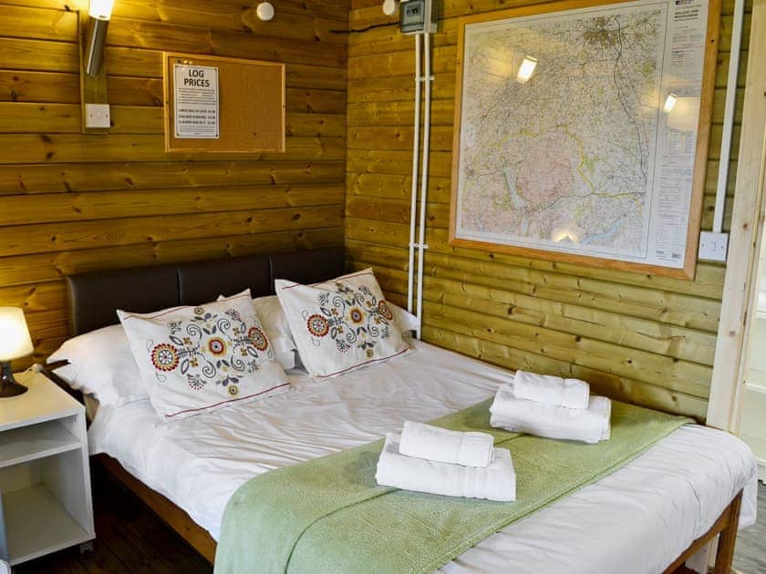 Comfortable sleeping area with double bed | Kestrel Cabin - Wallace Lane Farm Cottages, Brocklebank, near Caldbeck and Uldale