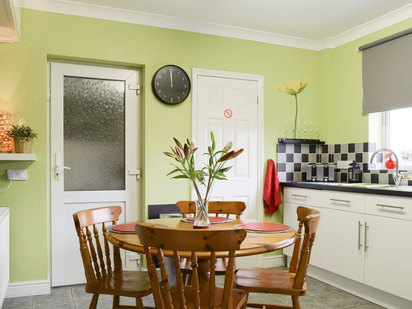 Spacious dining area within kitchen | Lena’s Lodge, Camer’s Green, Berrow, near Malvern
