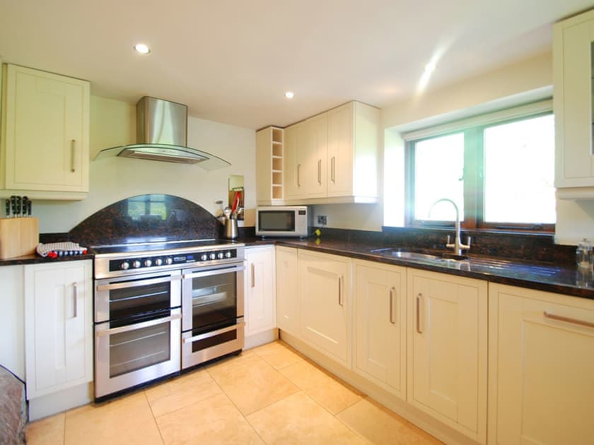 Delightful kitchen with range-style cooker | Ty Newydd, Llyn Geirionydd, near Llanrwst