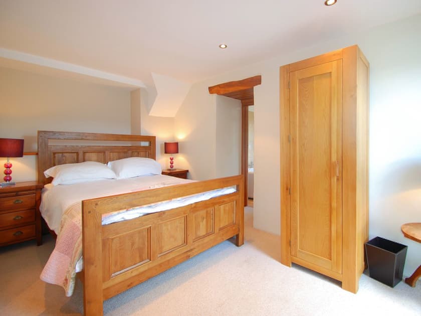 Impressive master bedroom with super kingsizr bed | Ty Newydd, Llyn Geirionydd, near Llanrwst