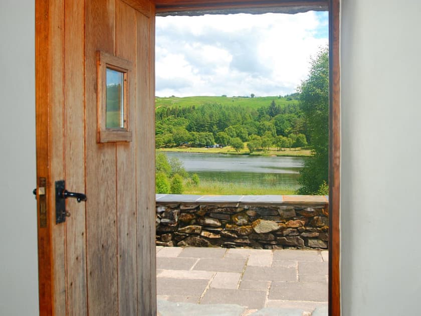 Breathtaking view across the lake from the front door | Ty Newydd, Llyn Geirionydd, near Llanrwst