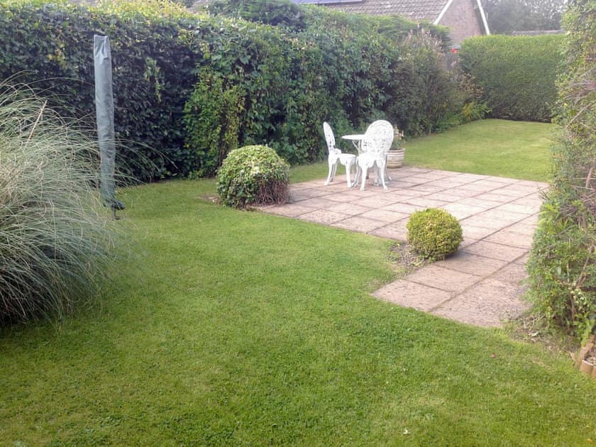 Lawned garden with paved patio | Clinton Cottage, Yaxham, near Norwich