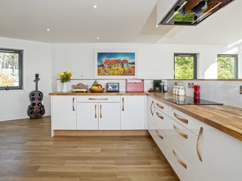Wooden floors throughout the kitchen and living areas | Strathspey Lodge, Duthil, Carrbridge, near Aviemore