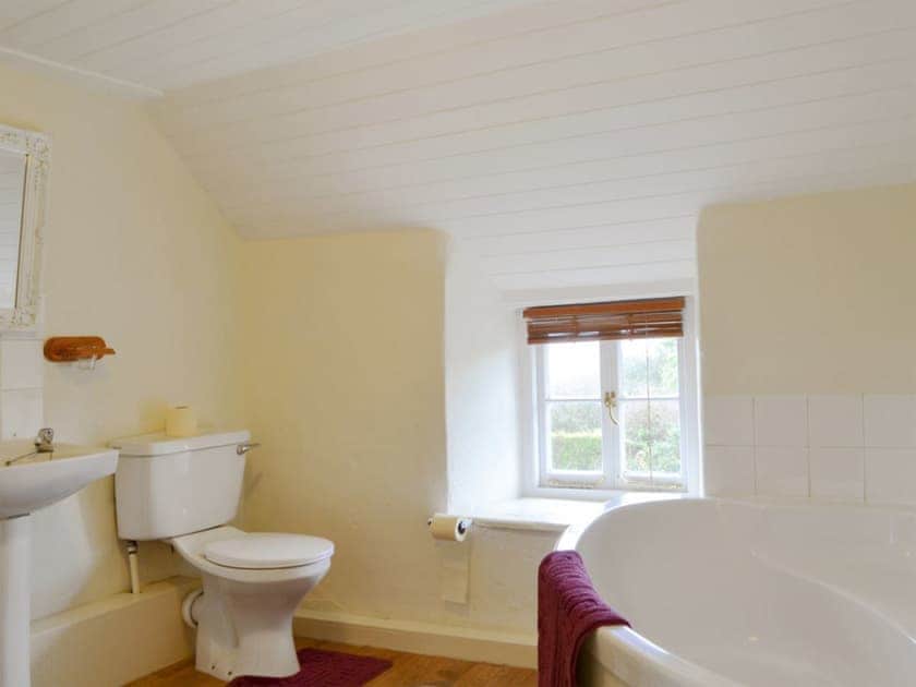 Bathroom with corner bath | Mulberry Cottage - Acton Cottages, Acton, near Langton Matravers
