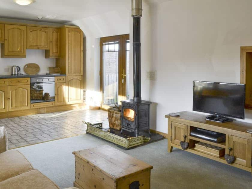 Open-plan living space with a wood burner | Shedend, Nether Dallachy, near Spey Bay