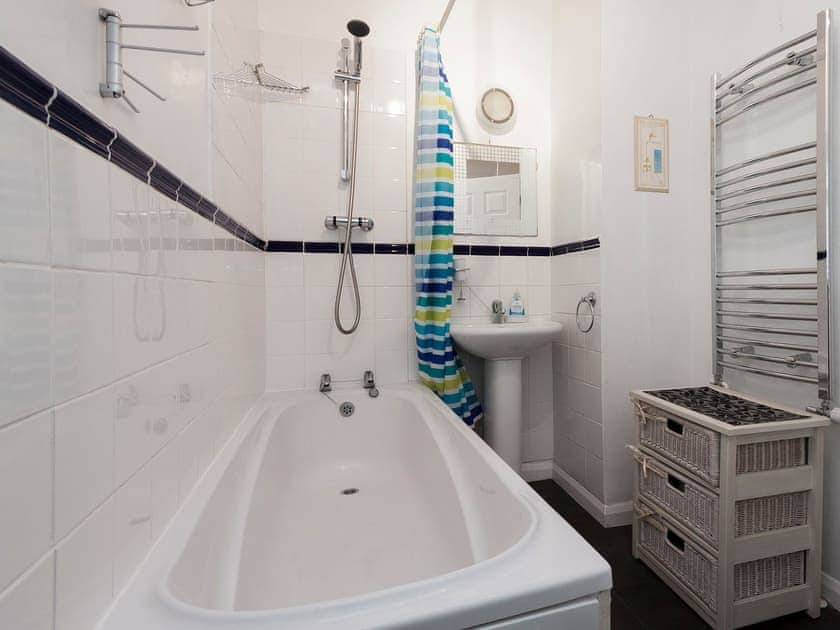 Tiled bathroom with shower over bath | Lower Street 10, Apartment 3, Dartmouth