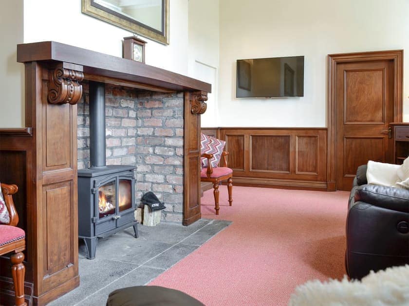 Welcoming living room with wood burner | Yr Hen Fanc, Trawsfynydd, near Blaenau Ffestiniog