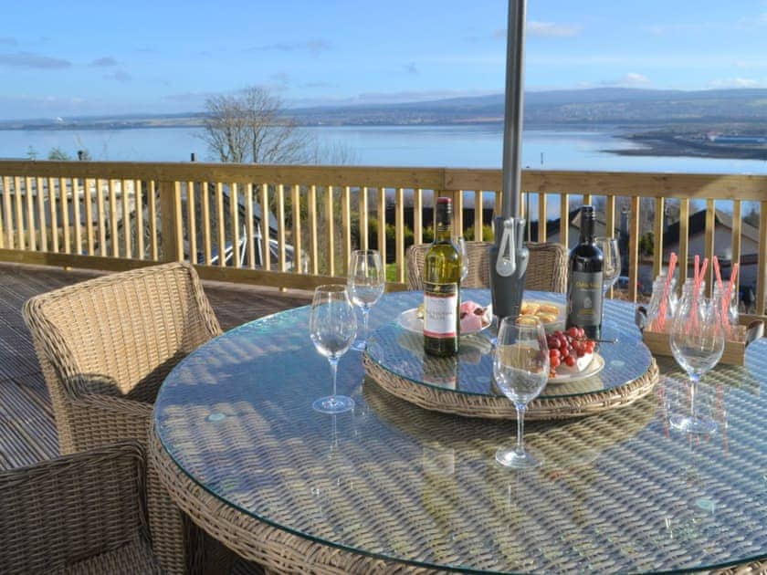 Outdoor dining area with wonderful waterside views | Balnacraig, Craigton, near Inverness