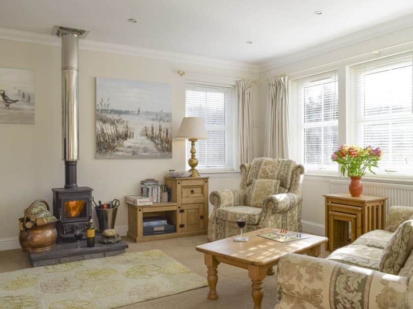 Welcoming living room with wood burner | Heather Croft - Hatton Cottages, Dunkeld, near Pitlochry