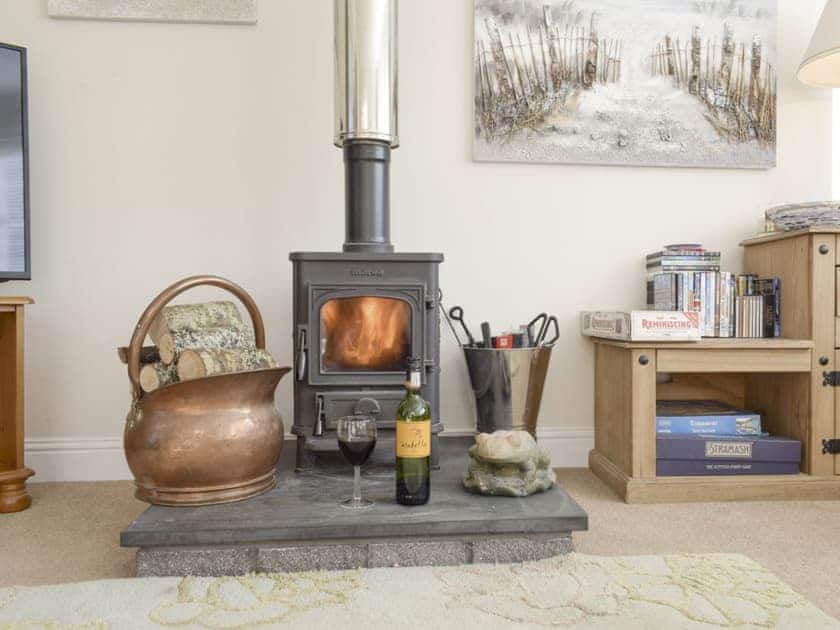 Warming wood burner in living room | Heather Croft - Hatton Cottages, Dunkeld, near Pitlochry