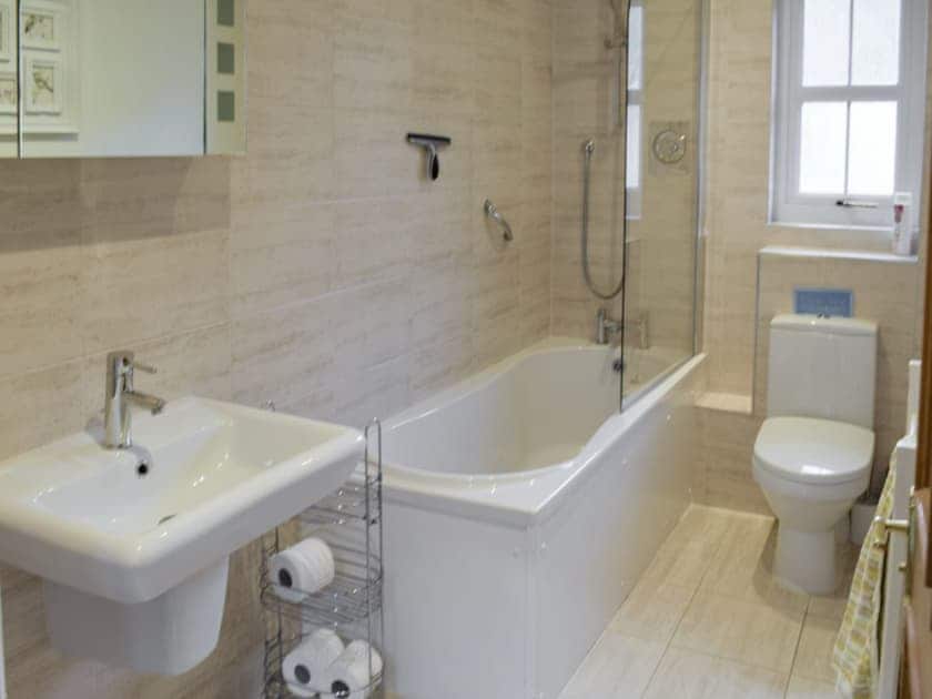 Family bathroom with shower over bath | Heather Croft - Hatton Cottages, Dunkeld, near Pitlochry