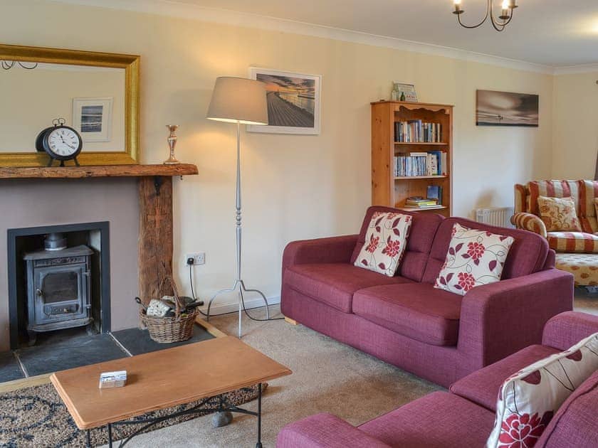 Lovely living room with wood burner | Sand Castles, Seahouses